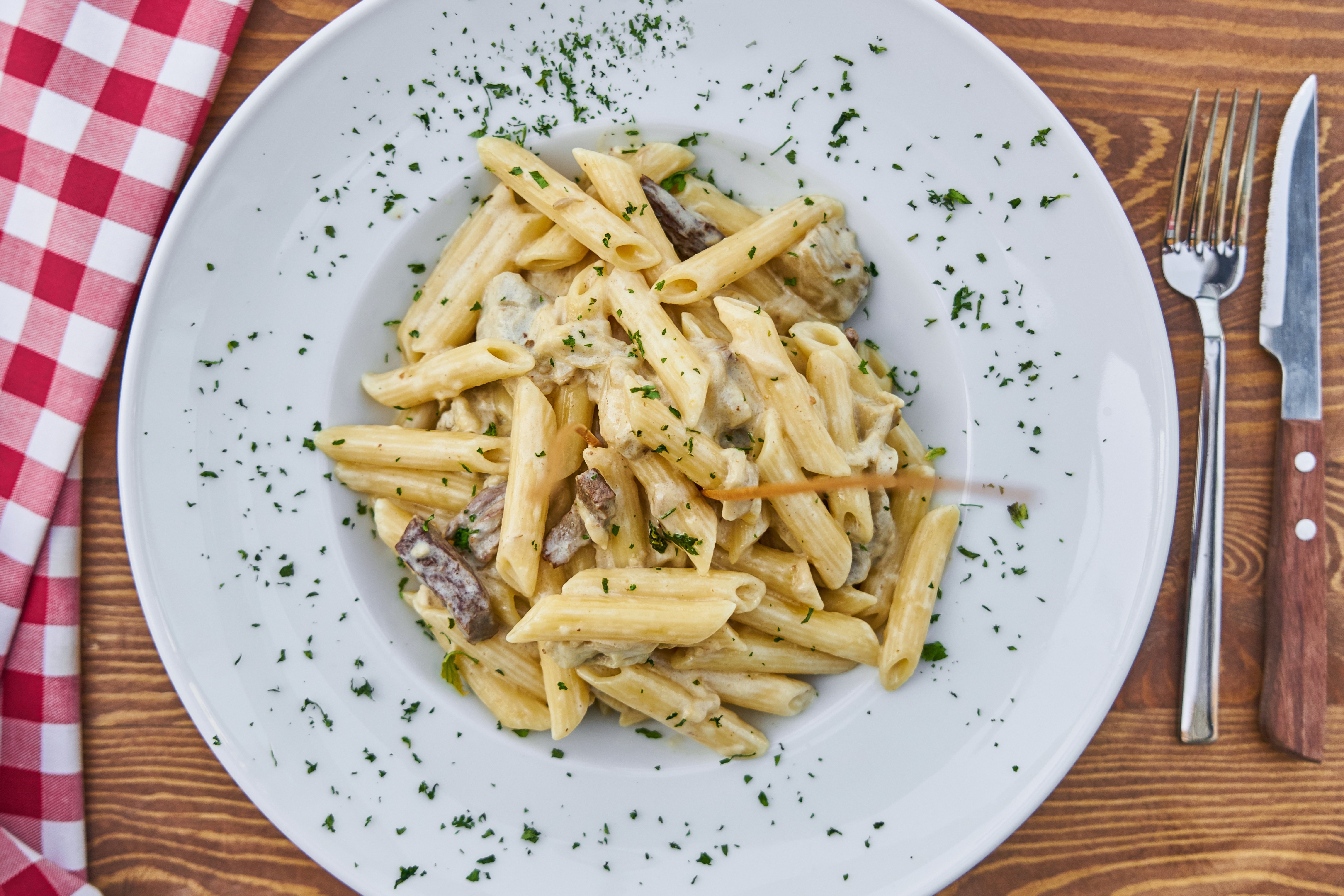 pene pasta on a white plate