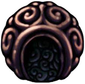 The shaman stone charm. It is metallic like bronze and has snail shell patterns all over.